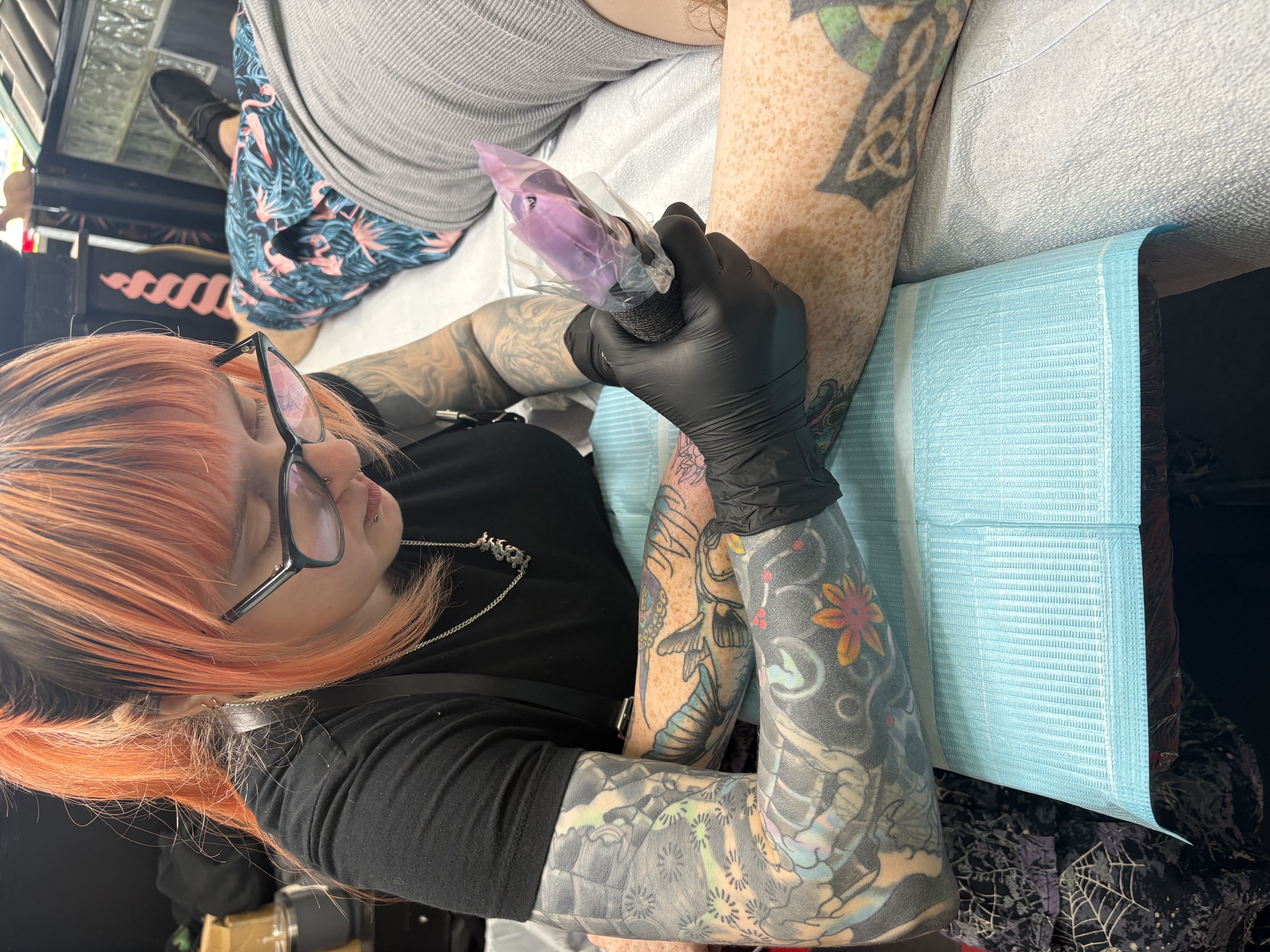 Frye tattooing a client